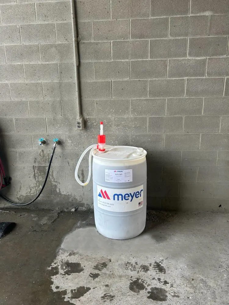 Meyer Lab chemical drum with a wall-mounted dispenser